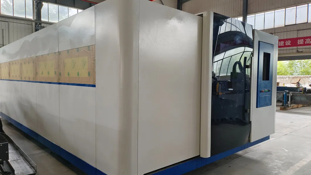 AC380V/50Hz/60Hz Power Supply Exchange Table Laser Cutting Machine With Enclosed Protective Cover 3000W Laser Power 4